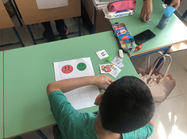 image of a young person at a table