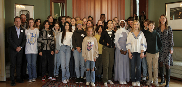 a group of young people pose for a photograph