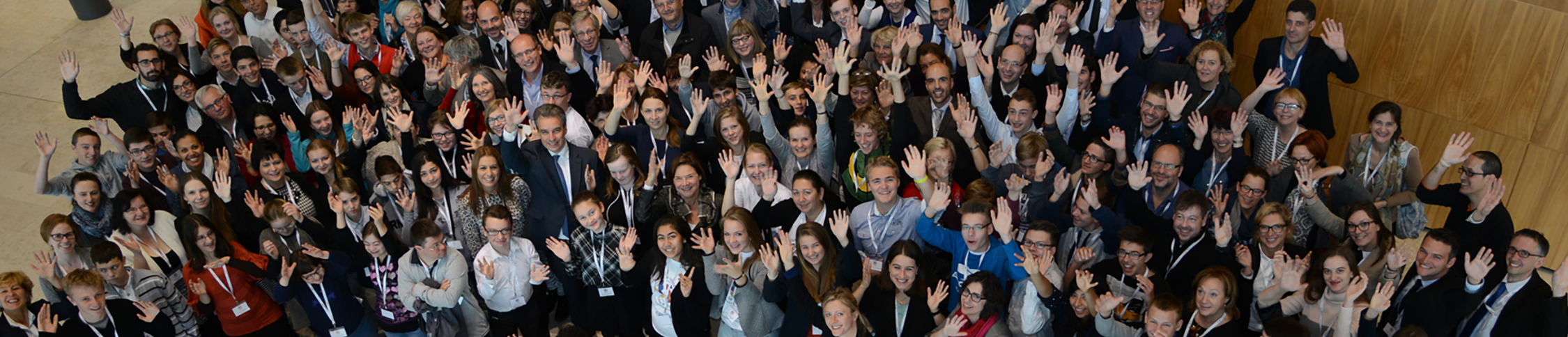 image of young people at a conference gathering