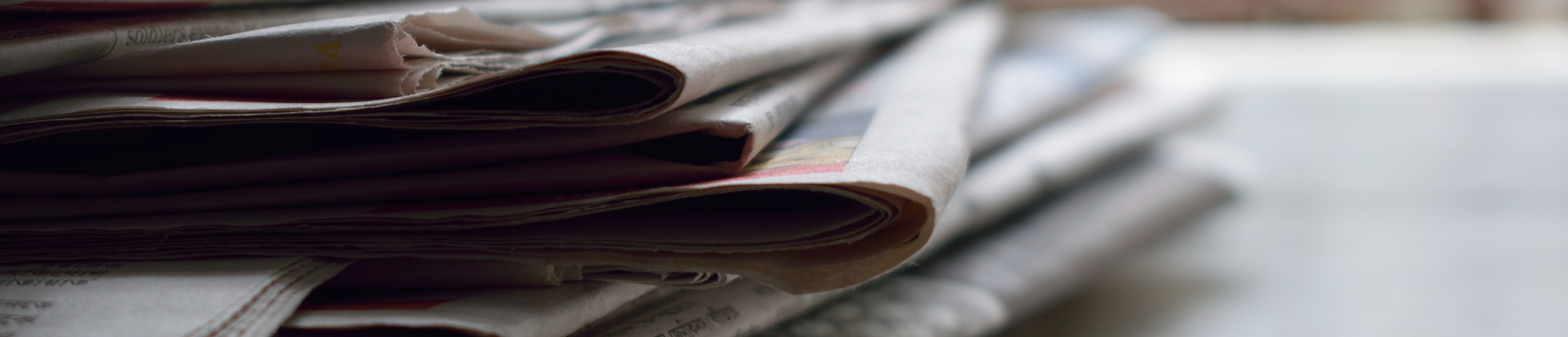 image of newspapers on a desk