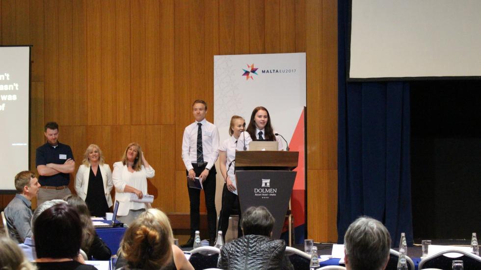 students speaking at the event in Malta