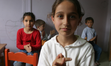 Children clap to music in a preschool at the Social Services and Child Protection agency in Istanbul