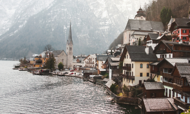 Austrian lakeside town with mountains in the background