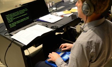 image of young person using assistive technology