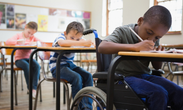 Children working at desks in a classroom