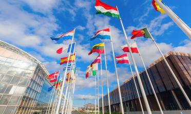 European flags against a blue sky