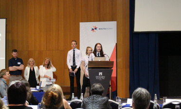 students speaking at the event in Malta