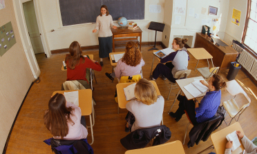 photo of teacher with students