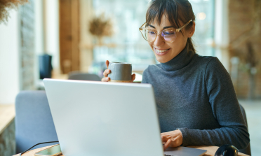 A woman works at a computer