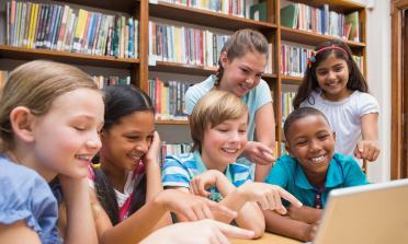 A group of children working at a computer