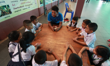 young people discussing at a table