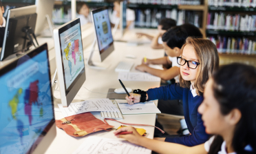 young students in front of the computer