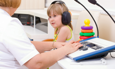 young learner participating ina hearing test