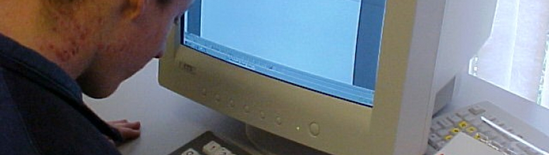 image of a young person working at a computer