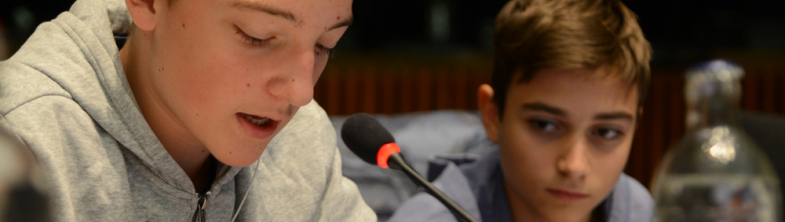 Young people speaking in the plenary session