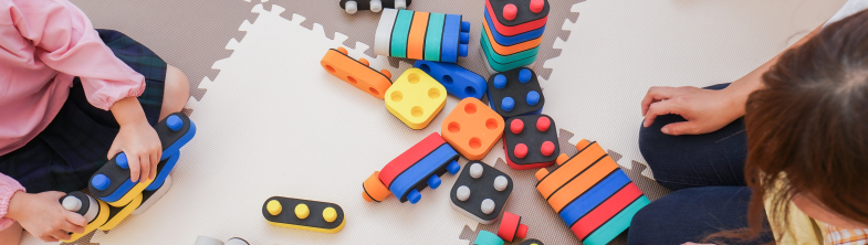 Children playing with colourful blocks