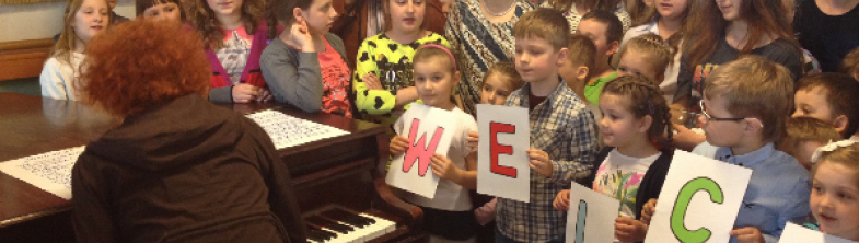 Students welcoming the participants of the Raising Achievement project