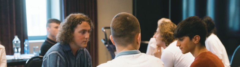 Three young people having a discussion