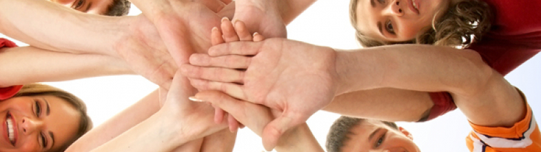 young people forming a circle