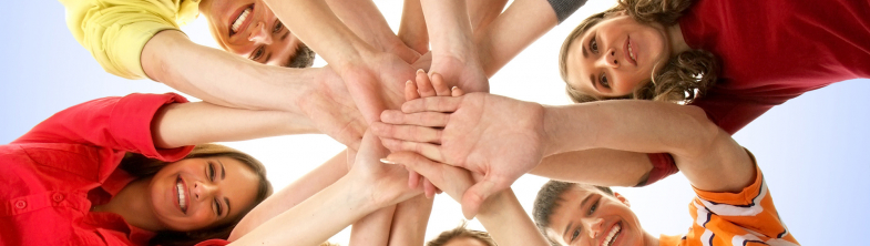 young people forming a circle with their hands