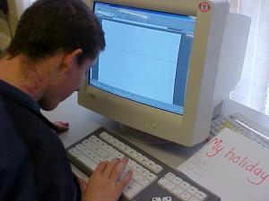image of a young person working at a computer