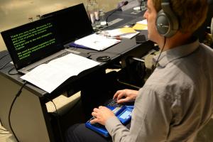 image of young person using assistive technology
