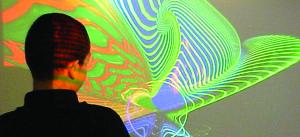 young person looking at a screen with projection